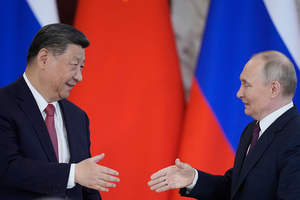 Chinese President Xi Jinping shakes hands with Russian President Vladimir Putin on May 8, 2025.