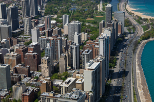 An aerial view of Lake Shore Drive and Chicago's skyline heading north towards Lincoln Park.