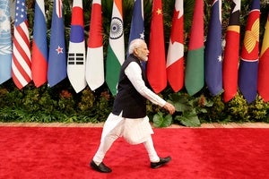 India's Prime Minister Narendra Modi walks past the flags of participating countries at the Association of Southeast Asian Nations (ASEAN) Summit, in Jakarta, Indonesia on September 7, 2023.