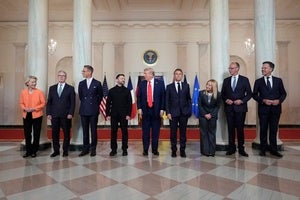President Donald Trump stands in the middle of a line of European leaders for a photo at the White House on August 18, 2025.