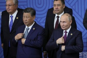 Chinese President Xi Jinping and Russian President Vladimir Putin at a BRICS summit