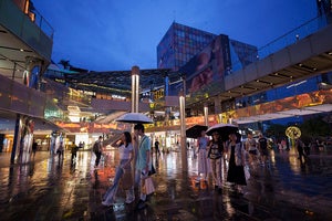 People shop at Taikoo Li Sanlitun shopping center in Beijing, China
