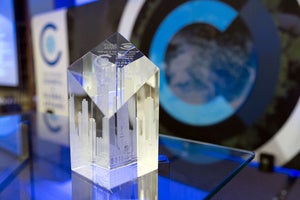 A glass award on top of a table
