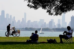 Chicagoans enjoy a day on the lakefront as Lake Michigan and the skyline loom in the background.