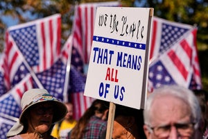 Protesters gather outside the U.S. Immigration and Customs Enforcement regional field office in Burlington, Mass