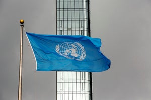 The UN flag flies on a stormy day at the United Nations during the United Nations General Assembly