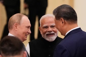 Vladimir Putin, Narendra Modi, and Xi Jinping speak at the Shanghai Cooperation Organization summit on September 1, 2025.
