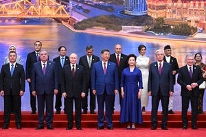 Chinese President Xi Jinping (center) stands among other global leaders at Shanghai Cooperation Organization summit in Tianjin, China, on August 31, 2025.