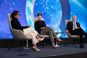 Paramita Das, Alaina Harkess, and Karl Friedhoff on the council stage.