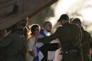 An Israeli hostage released from the Gaza Strip walks off a helicopter at the Sheba Medical Center in Ramat Gan, Israel.