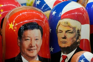 Wooden dolls depicting China's President Xi Jinping and US President Donald Trump