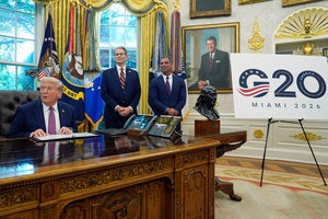 President Donald Trump speaks in the Oval Office of the White House as Treasury Secretary Scott Bessent and Miami Mayor Francis Suarez listen