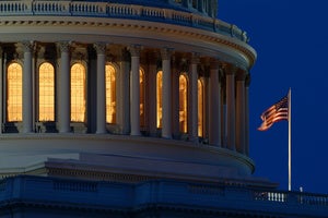 Capital dome at night with American flag