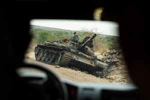 A destroyed tank is seen by the side of the road south of Humera, in an area of western Tigray