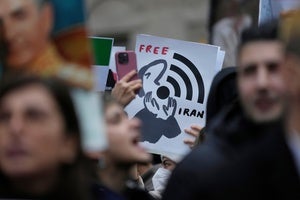 Protesters participate in a demonstration supporting protesters in Iran, in front of the US Consulate, Milan, Italy, Tuesday, Jan. 13, 2026.