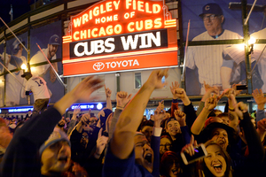 Chicago Cubs fans celebrate outside Wrigley Field after the team clinched the National League Division Series against the St. Louis Cardinals on October 13, 2015.