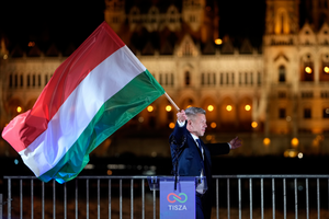 Péter Magyar waves a Hungarian flag after winning the parliamentary elections a parliamentary election in Budapest, Hungary on April 12, 2026.