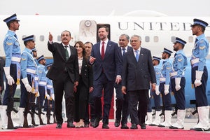 US Vice President JD Vance walks with Pakistani officials after arriving for talks with Iranian negotiators