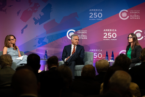 Panel of speakers on a stage