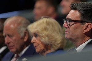 British Prime Minister Andy Burnham sits next to Queen Camilla and King Charles III at the Commonwealth Games opening ceremony in Glasgow, Scotland on July 27, 2026.