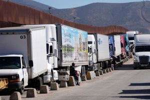 Trucks line up to cross the border into the United States