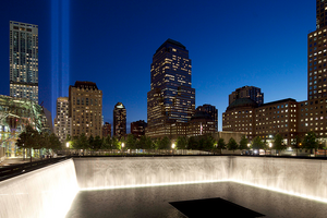 The Tribute in Light shines above a reflecting pool at the National September 11 Memorial in New York City on September 11, 2012.