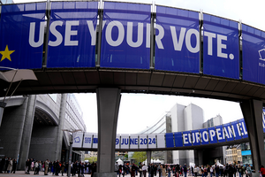 Banners that read "Use Your Vote" hang above the European Parliament during Europe Day celebrations in Brussels on May 4, 2024.