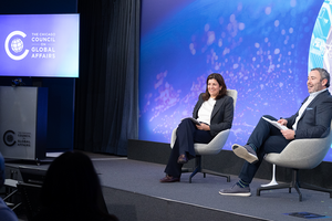 Leslie Vinjamuri and Tom Wyler sitting onstage at a Chicago Council on Global Affairs event.