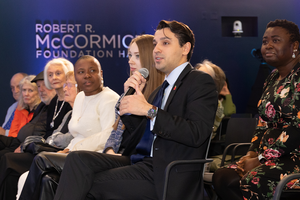 An event attendee asks a question during a Council event Q&A.