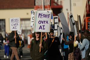 Protesters demonstrate outside of the OpenAI DevDay 2026 conference