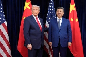 President Donald Trump, left, and Chinese President Xi Jinping pose ahead of their summit talk at Gimhae International Airport in Busan, South Korea, Thursday, Oct. 30, 2025.