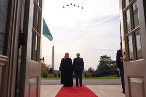 President Donald Trump and Saudi Arabia's Crown Prince Mohammed bin Salman watch a flight of F-35's and F-15's fly over during a welcome ceremony on the South Lawn of the White House, Tuesday, Nov. 18, 2025, in Washington.