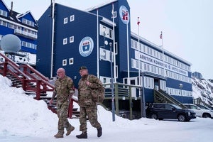 Danish servicemen walk in front of Joint Arctic Command center in Nuuk, Greenland, on Friday, Jan. 16, 2026. 
