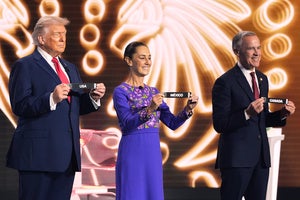President Donald Trump, Mexican President Claudia Sheinbaum and Canadian Prime Minister Mark Carney hold their countries' cards during the draw for the 2026 soccer World Cup at the Kennedy Center in Washington, Friday, Dec. 5, 2025