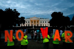 Protesters hold signs spelling out, "No War," outside the White House, Thursday June 20, 2019, in Washington, after President Donald Trump tweeted that "Iran made a very big mistake" by shooting down a U.S. surveillance drone over the Strait of Hormuz in Iran.