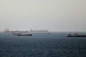 Tankers and cargo vessels are seen in the Gulf of Oman, along shipping routes linking the Strait of Hormuz and the Arabian Sea, Tuesday, June 16, 2026.