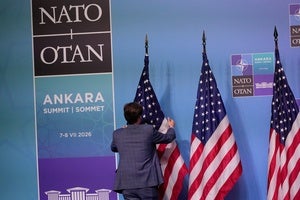 A member of protocol arranges U.S. flags prior to a media conference at the NATO summit in Ankara, Turkey, Wednesday, July 8, 2026. 