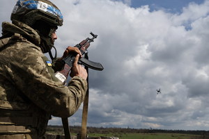 A Ukrainian serviceman shoots towards a drone during training at the polygon, in Zaporizhzhia region, Ukraine.