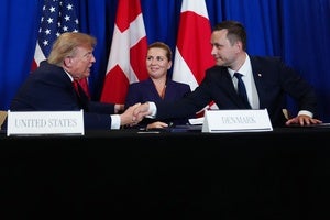 President Donald Trump shakes hands with Greenland's Prime Minister Jens-Frederik Nielsen, before signing a security agreement during the United Nations General Assembly, Tuesday, Sept. 22, 2026, at the UN headquarters, as Denmark's Prime Minister Mette Frederiksen, center, looks on.