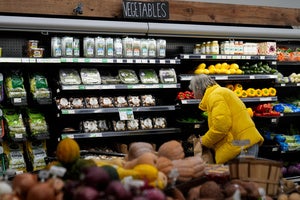 A shopper looks at produce at a grocery store Tuesday, Feb. 10, 2026, in Chicago.