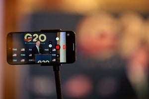 A phone records U.S. Trade Representative Jamieson Greer speaking during a press conference Thursday, Oct. 1, 2026, at the G20 Trade Ministerial in Milwaukee, Wis.