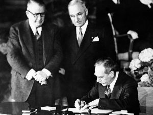 A black and white photo of the signing of the North Atlantic Treaty
