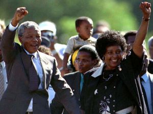 Nelson Mandel raising his fist after the 1990 South African elections