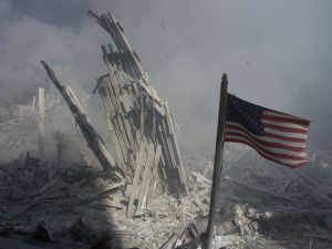 An American flag waves at the base of the World Trade Center on Sept. 11, 2001. 