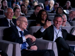 People in the audience laughing during a program