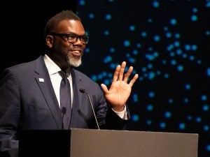 Chicago Mayor Brandon Johnson speaks behind a podium