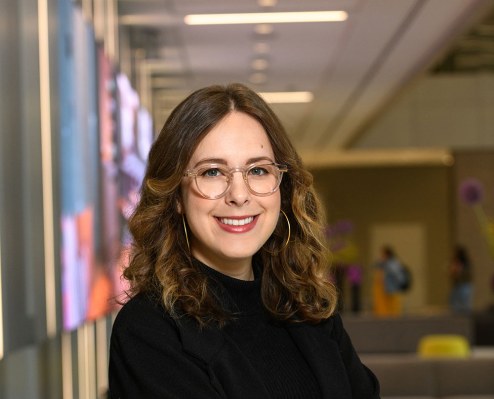 Hannah Long-Higgins' professional headshot is pictured.