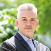Council expert Matthew Porter is pictured outside in a suit looking into the camera