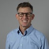 headshot of Joshua Busby