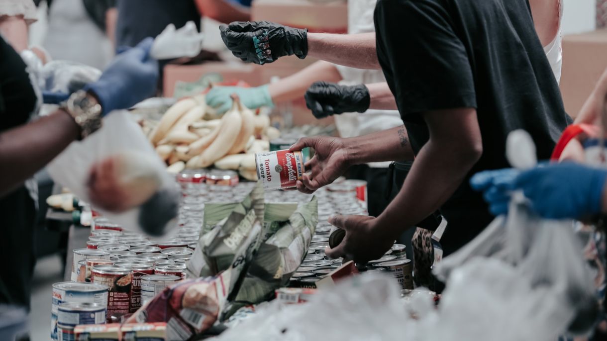 People shop at a community food bank